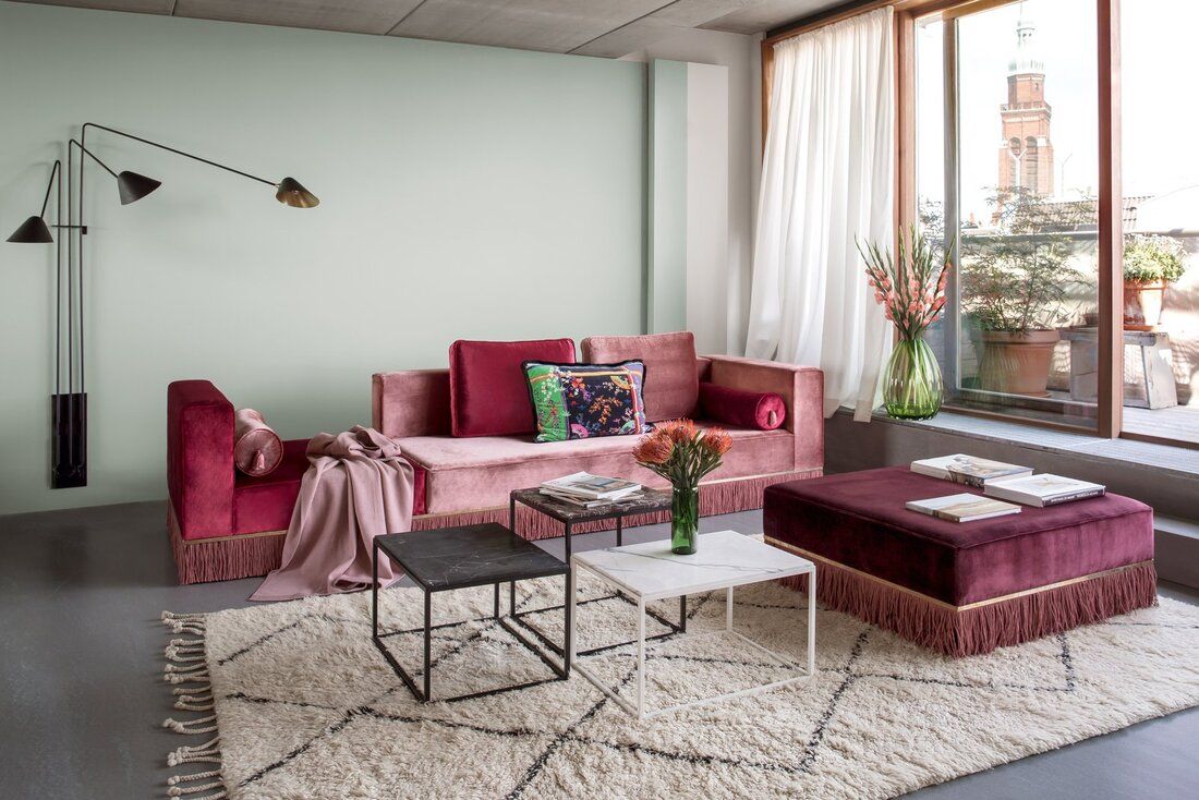 selecting design and color of curtains, Designer Esther Bruzkus embraced bold color and texture in her Berlin apartment, leaving the window coverings to play a more subtle role.